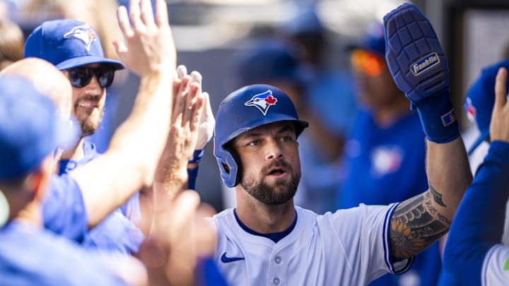 Aug 31, 2025; Toronto, Ontario, CAN; Toronto Blue Jays outfielder Nathan Lukes (38) celebrates with teammates after scoring against the Milwaukee Brewers during the first inning at Rogers Centre. 