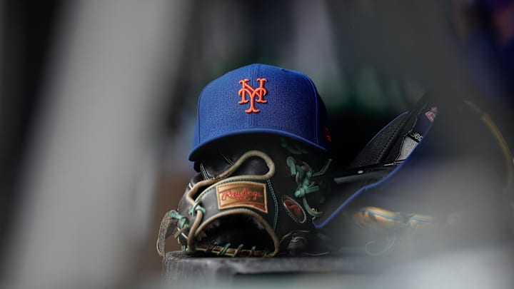 Aug 8, 2024; Denver, Colorado, USA; A New York Mets hat and glove in the dugout in the second inning against the Colorado Rockies at Coors Field. Mandatory Credit: Isaiah J. Downing-Imagn Images