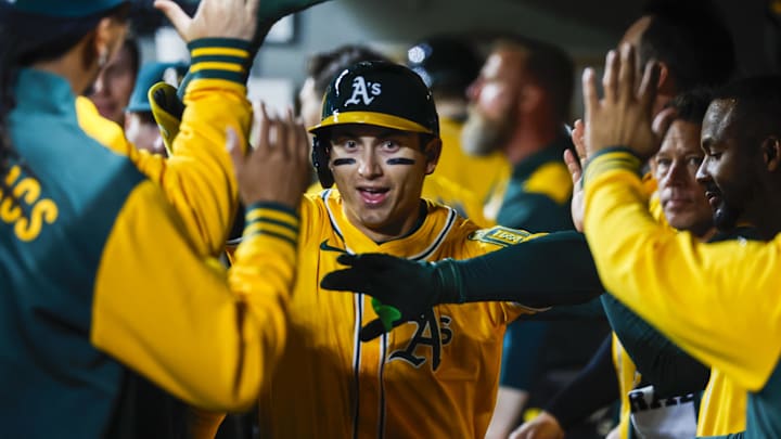 Mar 27, 2025; Seattle, Washington, USA; Athletics first baseman Tyler Soderstrom (21) celebrates in the dugout after hitting a solo-home run against the Seattle Mariners during the fifth inning at T-Mobile Park. Mandatory Credit: Joe Nicholson-Imagn Images Mar 27, 2025; Seattle, Washington, USA; Athletics first baseman Tyler Soderstrom (21) celebrates in the dugout after hitting a solo-home run against the Seattle Mariners during the fifth inning at T-Mobile Park. Mandatory Credit: Joe Nicholson-Imagn Images
