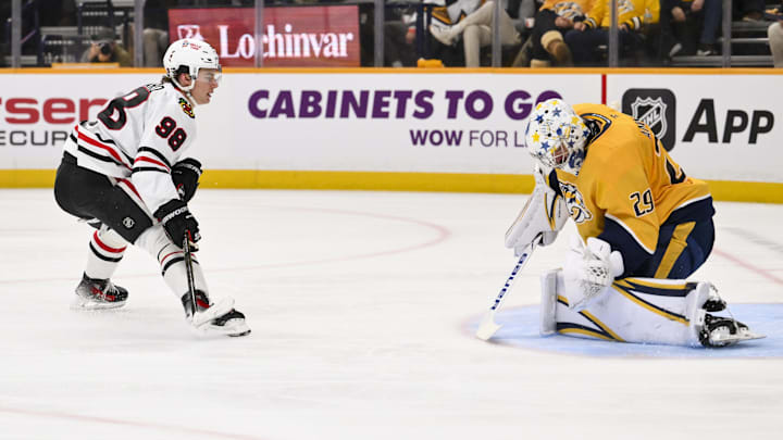 Feb 26, 2026; Nashville, Tennessee, USA;  Nashville Predators goaltender Justus Annunen (29) blocks the shot of Chicago Blackhawks center Connor Bedard (98) during the second period at Bridgestone Arena. Mandatory Credit: Steve Roberts-Imagn Images