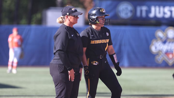May 9, 2024; Auburn, AL, USA;  Missouri Tigers head coach Larissa Anderson talks with infielder Maddie Gallagher (1) during the game against the Florida Gators in the SEC Softball Championship game at Jane B. Moore Field. Mandatory Credit: John Reed-Imagn Images