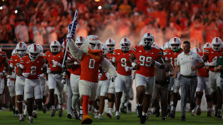 Aug 31, 2025; Miami Gardens, Florida, USA; The Miami Hurricanes take the field before the game against the Notre Dame Fighting Irish at Hard Rock Stadium. Mandatory Credit: Sam Navarro-Imagn Images