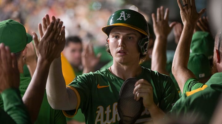Aug 29, 2025; West Sacramento, California, USA; Athletics second baseman Zack Gelof (20) high fives team mates after scoring against the Texas Rangers during the third inning at Sutter Health Park. Mandatory Credit: Ed Szczepanski-Imagn Images