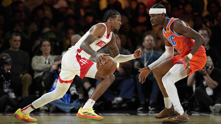 Dec 14, 2024; Las Vegas, Nevada, USA; Houston Rockets guard Jalen Green (4) controls the ball against Oklahoma City Thunder guard Shai Gilgeous-Alexander (2) during the second quarter in a semifinal of the 2024 Emirates NBA Cup at T-Mobile Arena. Mandatory Credit: Kyle Terada-Imagn Images