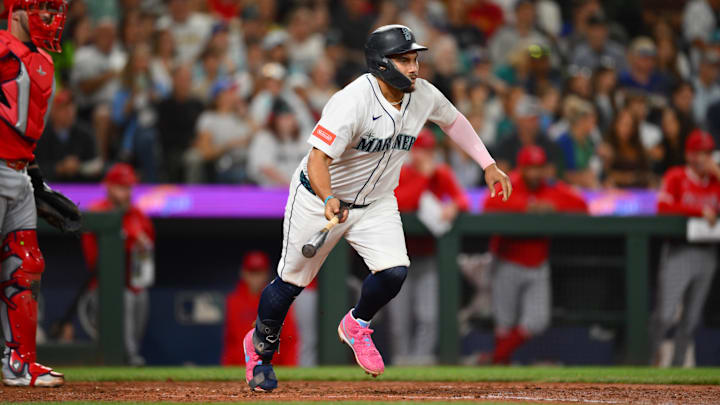 Sep 13, 2025; Seattle, Washington, USA; Seattle Mariners first baseman Josh Naylor (12) runs towards first base after hitting a 2-RBI single against the Los Angeles Angels during the fifth inning at T-Mobile Park. Mandatory Credit: Steven Bisig-Imagn Images Sep 13, 2025; Seattle, Washington, USA; Seattle Mariners first baseman Josh Naylor (12) runs towards first base after hitting a 2-RBI single against the Los Angeles Angels during the fifth inning at T-Mobile Park. Mandatory Credit: Steven Bisig-Imagn Images