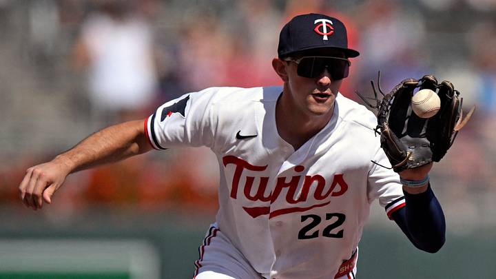 Aug 16, 2026; Minneapolis, Minnesota, USA;  Minnesota Twins infielder Brooks Lee (22) fields a ground ball against the Philadelphia Phillies during the seventh inning at Target Field. Mandatory Credit: Nick Wosika-Imagn Images