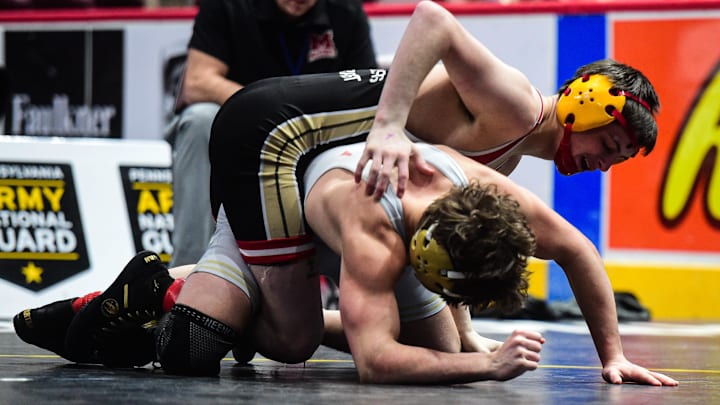 Bishop McCort’s Jax Forrest wrestles Berks Catholic’s Brayden Hartranft in PIAA AA championship action at 133 pounds at the Giant Center in Hershey, Pennsylvania on Friday, Mar. 7, 2025. Bishop McCort’s Jax Forrest wrestles Berks Catholic’s Brayden Hartranft in PIAA AA championship action at 133 pounds at the Giant Center in Hershey, Pennsylvania on Friday, Mar. 7, 2025.