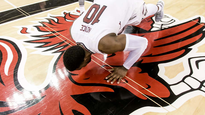 Feb 28, 2017; Columbia, SC, USA; South Carolina Gamecocks guard Duane Notice (10) kisses South Carolina Gamecocks logo in his last home game following their win over the Mississippi State Bulldogs at Colonial Life Arena. Mandatory Credit: Jeff Blake-Imagn Images