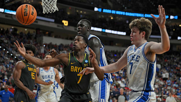 Mar 23, 2025; Raleigh, NC, USA; Baylor Bears guard VJ Edgecombe (7) goes for the ball during the first half against Duke Blue Devils guard Kon Knueppel (7) in the second round of the NCAA Tournament at Lenovo Center. Mandatory Credit: Zachary Taft-Imagn Images Mar 23, 2025; Raleigh, NC, USA; Baylor Bears guard VJ Edgecombe (7) goes for the ball during the first half against Duke Blue Devils guard Kon Knueppel (7) in the second round of the NCAA Tournament at Lenovo Center. Mandatory Credit: Zachary Taft-Imagn Images