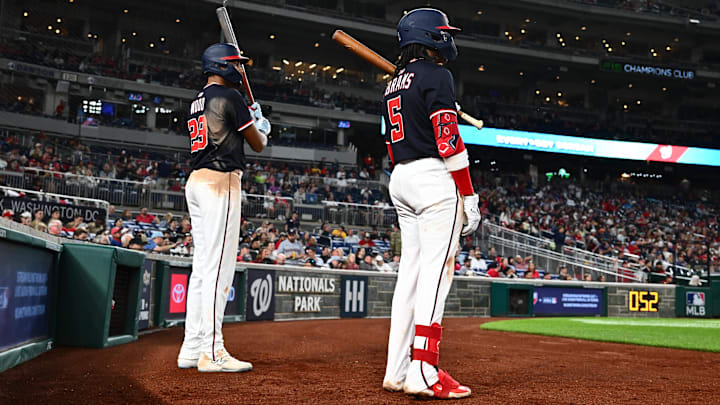 May 6, 2025; Washington, District of Columbia, USA;  Washington Nationals designated hitter James Wood (29) and shortstop CJ Abrams (5) wait for a pitching change during the sixth inning against the Cleveland Guardians at Nationals Park.
