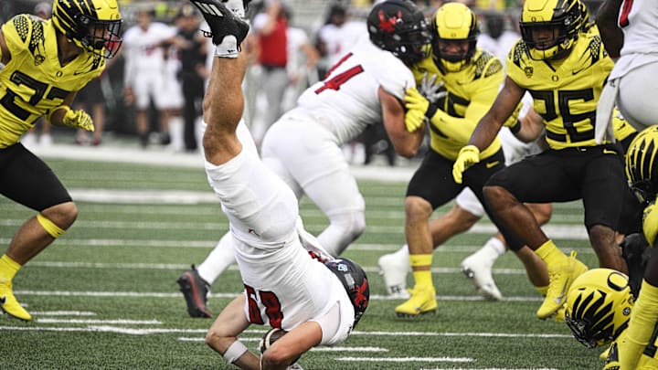 Sep 10, 2022; Eugene, Oregon, USA; Eastern Washington Eagles wide receiver Efton Chism III (89) is upended on a kickoff return during the first half against the Oregon Ducks at Autzen Stadium. The Ducks won 70-14.  Mandatory Credit: Troy Wayrynen-Imagn Images