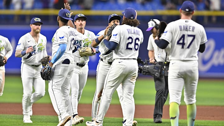 May 1, 2026; St. Petersburg, Florida, USA; Tampa Bay Rays teammates celebrate a win during the end of the ninth inning against San Francisco Giants at Tropicana Field.