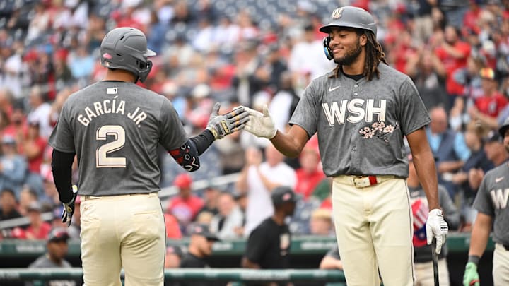 Sep 29, 2024; Washington, District of Columbia, USA; Washington Nationals second baseman Luis Garcia Jr. (2) celebrates at home plate with left fielder James Wood (29) after hitting a home run against the Philadelphia Phillies during the first inning at Nationals Park