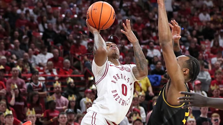 Feb 24, 2024; Fayetteville, Arkansas, USA; Arkansas Razorbacks guard Khalif Battle (0) is fouled while shooting by Missouri Tigers guard Tamar Bates (2) during the second half at Bud Walton Arena. Arkansas won 88-73. Mandatory Credit: Nelson Chenault-Imagn Images Feb 24, 2024; Fayetteville, Arkansas, USA; Arkansas Razorbacks guard Khalif Battle (0) is fouled while shooting by Missouri Tigers guard Tamar Bates (2) during the second half at Bud Walton Arena. Arkansas won 88-73. Mandatory Credit: Nelson Chenault-Imagn Images