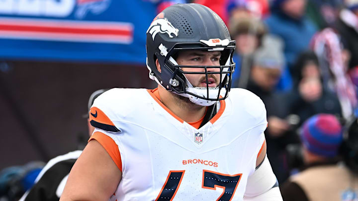Jan 12, 2025; Orchard Park, New York, USA; Denver Broncos offensive tackle Alex Palczewski (63) enters the field before an AFC wild card game against the Buffalo Bills at Highmark Stadium. 