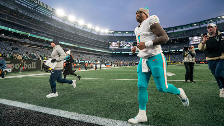 Miami Dolphins quarterback Tua Tagovailoa (1) jogs off the field following a 34-10 victory during a week 14 football game between the New York Jets and Miami Dolphins at MetLife Stadium on Sunday, Dec. 7, 2025.