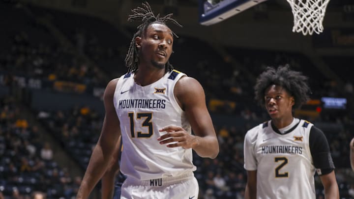 Dec 3, 2025; Morgantown, West Virginia, USA; West Virginia Mountaineers guard Chance Moore (13) celebrates after a play during the second half against the Coppin State Eagles at Hope Coliseum. Mandatory Credit: Ben Queen-Imagn Images