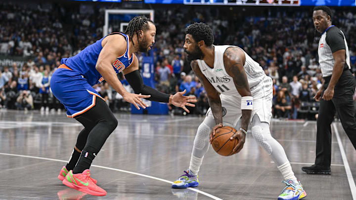 Nov 27, 2024; Dallas, Texas, USA; Dallas Mavericks guard Kyrie Irving (11) looks to move to the basket past New York Knicks guard Jalen Brunson (11) during the first quarter at the American Airlines Center. Mandatory Credit: Jerome Miron-Imagn Images