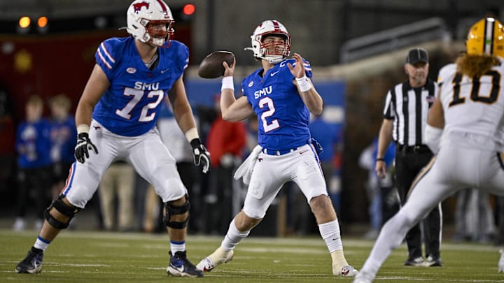 Nov 30, 2024; Dallas, Texas, USA; Southern Methodist Mustangs quarterback Preston Stone (2) passes for a touchdown to wide receiver Key'Shawn Smith (not pictured) during the second half against the California Golden Bears at Gerald J. Ford Stadium. Mandatory Credit: Jerome Miron-Imagn Images