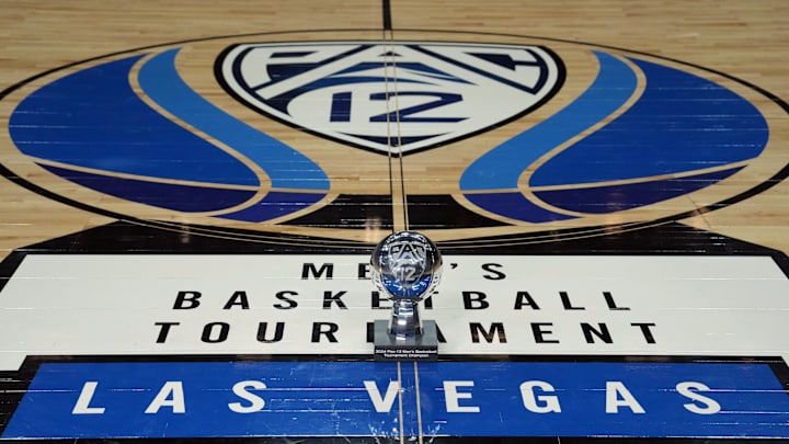 Mar 16, 2024; Las Vegas, NV, USA; The 2024 Pac-12 Conference men's basketball champion trophy at center court on the Pac-12 logo at T-Mobile Arena. Mandatory Credit: Kirby Lee-Imagn Images