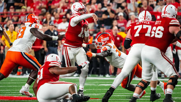 Sep 20, 2024; Lincoln, Nebraska, USA; Nebraska Cornhuskers quarterback Dylan Raiola (15) passes against Illinois Fighting Illini linebacker Jojo Hayden (30) during the second quarter at Memorial Stadium.
