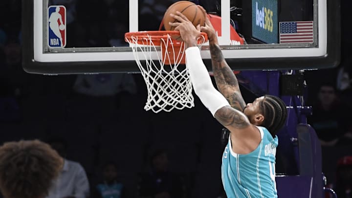Dec 16, 2024; Charlotte, North Carolina, USA; Charlotte Hornets center Nick Richards (4) dunks during the first half against the Philadelphia 76ers at the Spectrum Center. Mandatory Credit: Sam Sharpe-Imagn Images Dec 16, 2024; Charlotte, North Carolina, USA; Charlotte Hornets center Nick Richards (4) dunks during the first half against the Philadelphia 76ers at the Spectrum Center. Mandatory Credit: Sam Sharpe-Imagn Images