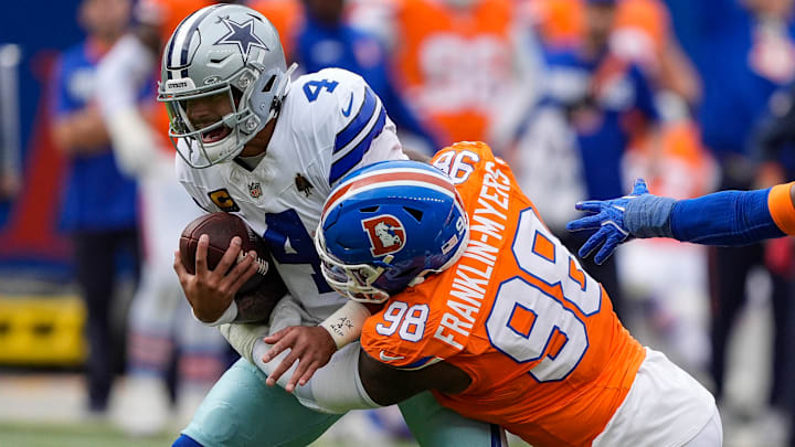 October 26, 2025: Dallas Cowboys quarterback Dak Prescott (4) is sacked by Denver Broncos defensive end John Franklin-Myers (98) win the first half of the football game between the Denver Broncos and Dallas Cowboys. 