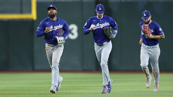 Aug 8, 2026; Phoenix, Arizona, USA; Los Angeles Dodgers outfielder Kyle Tucker (23), Los Angeles Dodgers outfielder Teoscar Hernandez (37), and Los Angeles Dodgers outfielder Andy Pages (44) run in after beating the Arizona Diamondbacks 2-1 in the tenth inning at Chase Field. Mandatory Credit: Anna Carrington-Imagn Images