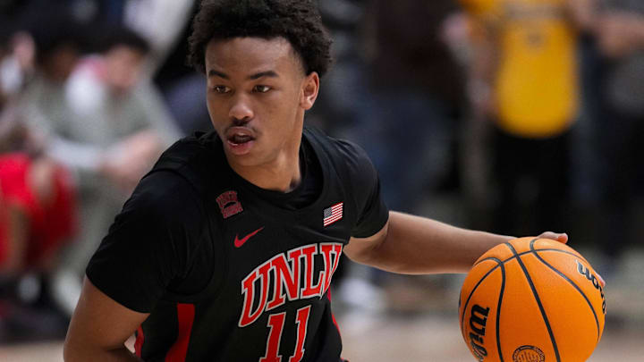 UNLV Runnin' Rebels guard Dedan Thomas Jr. (11) drives against the Wyoming Cowboys during the first half at Arena-Auditorium. Mandatory Credit: Troy Babbitt-Imagn Images