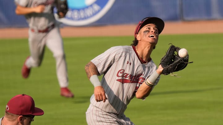 May 20, 2025; Hoover, AL, USA; South Carolina second baseman Jordan Carrion (24) tracks down a pop fly behind first base during the game with Florida in the first round of the SEC Baseball Tournament at the Hoover Met.