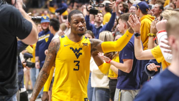 Mar 5, 2022; Morgantown, West Virginia, USA; West Virginia Mountaineers forward Gabe Osabuohien (3) celebrates with students after defeating the TCU Horned Frogs at WVU Coliseum.