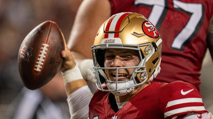 Oct 27, 2024; Santa Clara, California, USA; San Francisco 49ers quarterback Brock Purdy (13) spikes the football after scoring the touchdown against the Dallas Cowboys during the third quarter at Levi's Stadium. Mandatory Credit: Neville E. Guard-Imagn Images