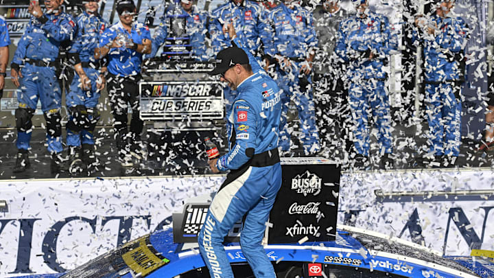 Sep 7, 2025; Madison, Illinois, USA; NASCAR Cup Series driver Denny Hamlin (11) celebrates with his team after winning the Enjoy Illinois 300 at World Wide Technology Raceway. Sep 7, 2025; Madison, Illinois, USA; NASCAR Cup Series driver Denny Hamlin (11) celebrates with his team after winning the Enjoy Illinois 300 at World Wide Technology Raceway.