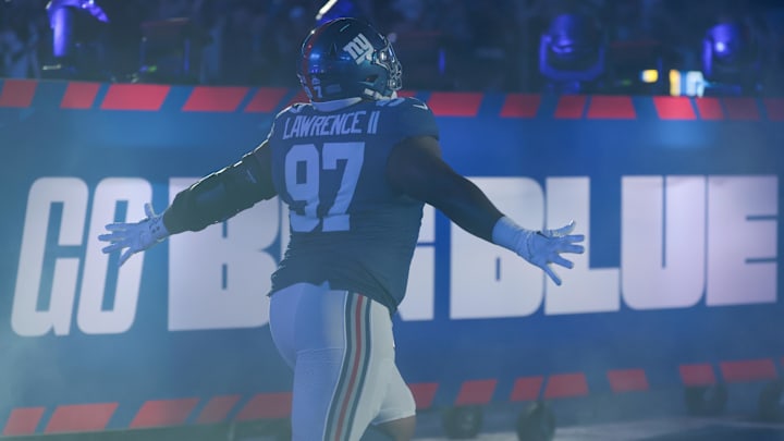 Oct 9, 2025; East Rutherford, New Jersey, USA; New York Giants defensive tackle Dexter Lawrence II (97) runs onto the field prior to the game against the Philadelphia Eagles at MetLife Stadium. Mandatory Credit: Vincent Carchietta-Imagn Images