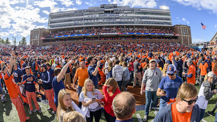 Oct 19, 2019; Champaign, IL, USA; Fans rush the field after the Illinois Fighting Illini's victory over the Wisconsin Badgers at Memorial Stadium. Mandatory Credit: Patrick Gorski-Imagn Images