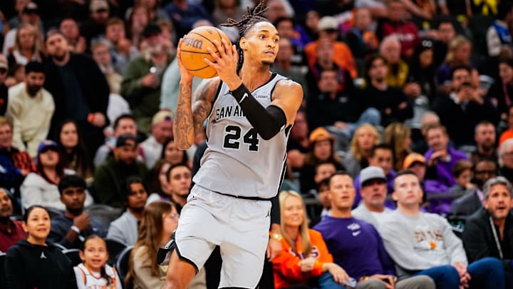 Nov 23, 2025; Phoenix, Arizona, USA; San Antonio Spurs guard Devin Vassell (24) grabs a pass in the second half of the game at Mortgage Match Up Center. Mandatory Credit: Arianna Grainey-Imagn Images Nov 23, 2025; Phoenix, Arizona, USA; San Antonio Spurs guard Devin Vassell (24) grabs a pass in the second half of the game at Mortgage Match Up Center. Mandatory Credit: Arianna Grainey-Imagn Images
