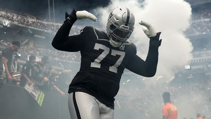 Sep 22, 2024; Paradise, Nevada, USA; Las Vegas Raiders offensive tackle Thayer Munford Jr. (77) enters the field before the game against the Carolina Panthers at Allegiant Stadium. Mandatory Credit: Kirby Lee-Imagn Images