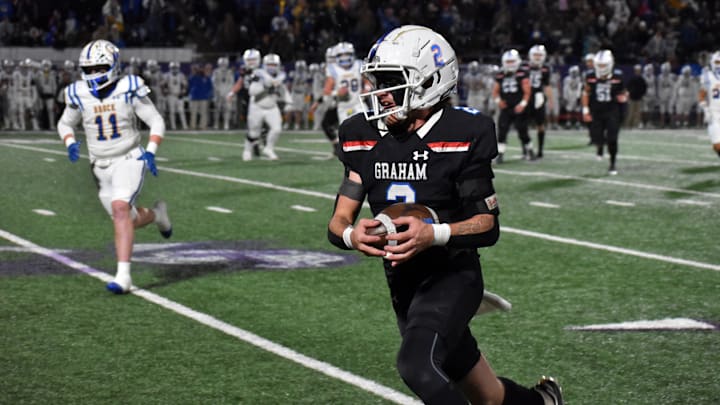 Graham running back Rylan Monsey hauls in a pass and runs for yardage in the first quarter of a UIL football Class 4 Division II regional final game against Brock at Tarleton Memorial Stadium on Friday, Dec. 6, 2024.