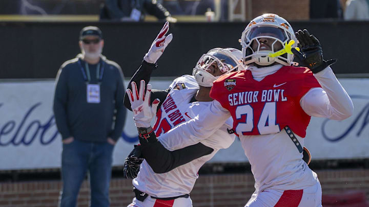 National Team wide receiver Vinny Anthony II of Wisconsin works against National Team cornerback Jalen McMurray (24) of Tennessee during National Senior Bowl practice at Hancock Whitney Stadium.