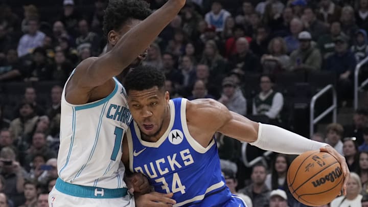 Nov 23, 2024; Milwaukee, Wisconsin, USA;  Milwaukee Bucks forward Giannis Antetokounmpo (34) drives to the basket against Charlotte Hornets forward Moussa Diabate (14) in the first half at Fiserv Forum. Mandatory Credit: Michael McLoone-Imagn Images