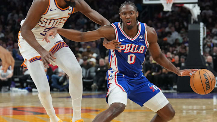 Nov 4, 2024; Phoenix, Arizona, USA; Philadelphia 76ers guard Tyrese Maxey (0) dribbles against Phoenix Suns forward Kevin Durant (35) during the second half at Footprint Center. Mandatory Credit: Joe Camporeale-Imagn Images