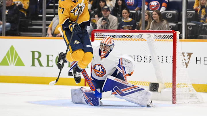Jan 8, 2026; Nashville, Tennessee, USA; New York Islanders goaltender David Rittich (33) blocks the shot of Nashville Predators right wing Luke Evangelista (77) during the first period at Bridgestone Arena. Mandatory Credit: Steve Roberts-Imagn Images Jan 8, 2026; Nashville, Tennessee, USA; New York Islanders goaltender David Rittich (33) blocks the shot of Nashville Predators right wing Luke Evangelista (77) during the first period at Bridgestone Arena. Mandatory Credit: Steve Roberts-Imagn Images