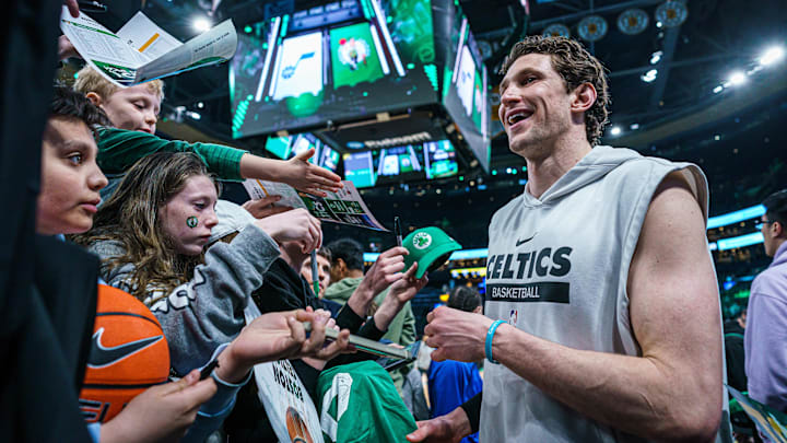 Mar 31, 2023; Boston, Massachusetts, USA; Boston Celtics center Mike Muscala (57) signs autographs before the start of the game against the Utah Jazz at TD Garden. Mandatory Credit: David Butler II-Imagn Images Mar 31, 2023; Boston, Massachusetts, USA; Boston Celtics center Mike Muscala (57) signs autographs before the start of the game against the Utah Jazz at TD Garden. Mandatory Credit: David Butler II-Imagn Images