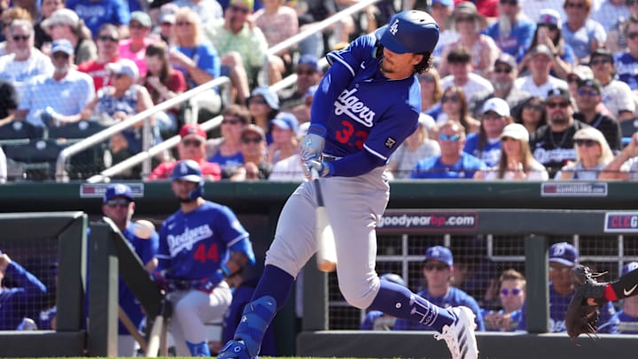 Feb 24, 2025; Goodyear, Arizona, USA; Los Angeles Dodgers outfielder James Outman (33) bats against the Cincinnati Reds during the second inning at Goodyear Ballpark. Mandatory Credit: Joe Camporeale-Imagn Images