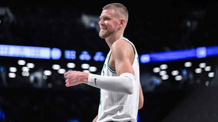 Mar 15, 2025; Brooklyn, New York, USA; Boston Celtics center Kristaps Porzingis (8) reacts during the second half against the Brooklyn Nets at Barclays Center. Mandatory Credit: John Jones-Imagn Images