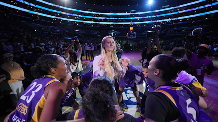 Jul 16, 2024; Los Angeles, California, USA; LA Sparks players huddle around forward Cameron Brink during the game against the Seattle Storm at Crypto.com Arena. Mandatory Credit: Kirby Lee-Imagn Images