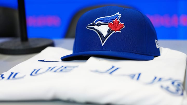Jan 6, 2026; Toronto, Ontario, Canada; The baseball cap and jersey sit on the table before the press conference of Toronto Blue Jays Kazuma Okamoto (not pictured) at Rogers Centre. Mandatory Credit: Nick Turchiaro-Imagn Images