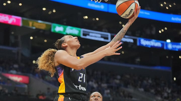 Jul 7, 2024; Los Angeles, California, USA; Phoenix Mercury forward Mikiah Herbert Harrigan (21) shoots the ball against the LA Sparks  in the first half at Crypto.com Arena. Mandatory Credit: Kirby Lee-Imagn Images