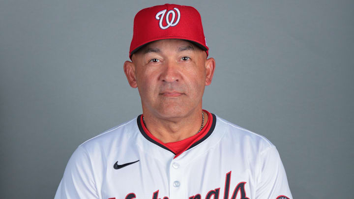 Feb 21, 2025; West Palm Beach, FL, USA; Washington Nationals bench coach Miguel Cairo (22) poses for a photo during picture day at CACTI Park of the Palm Beaches