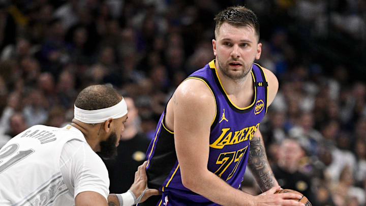 Apr 9, 2025; Dallas, Texas, USA; Dallas Mavericks center Daniel Gafford (21) and Los Angeles Lakers guard Luka Doncic (77) in action during the game between the Dallas Mavericks and the Los Angeles Lakers at American Airlines Center. Mandatory Credit: Jerome Miron-Imagn Images